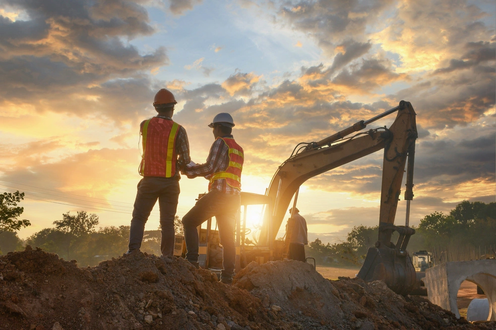 two engineers in front of a construction site